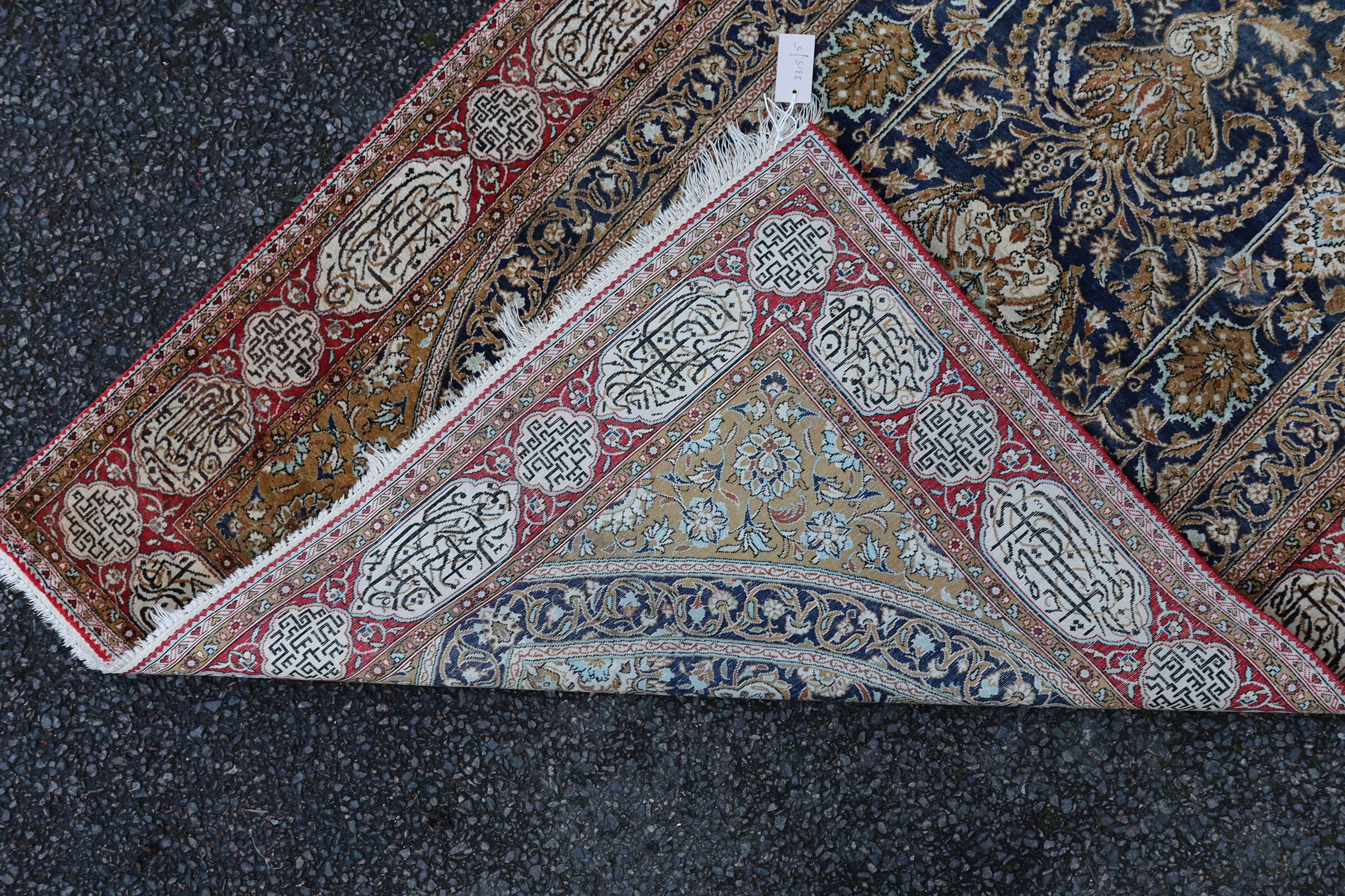 An early 20th century Kashan silk blue ground prayer rug, 162 x 109cm.